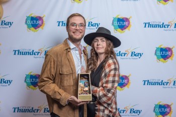 Small Town Bad posing with their award